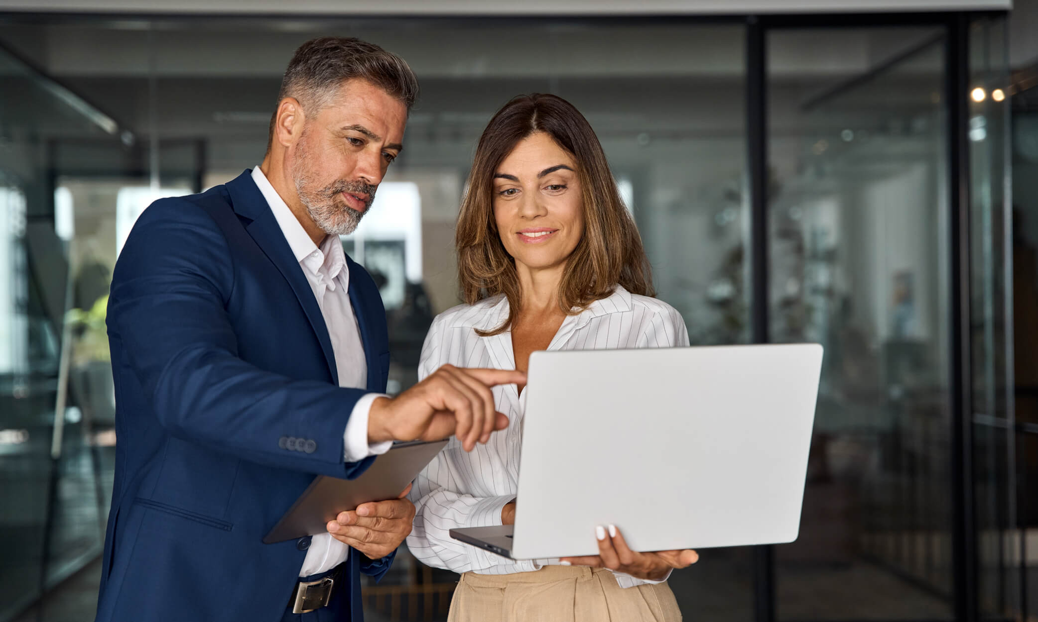 Two people discussing work on the computer.